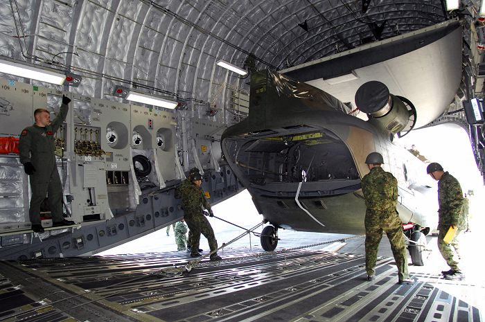 CH-47J Chinook helicopters practice strategic air movement by C-17 aircraft.