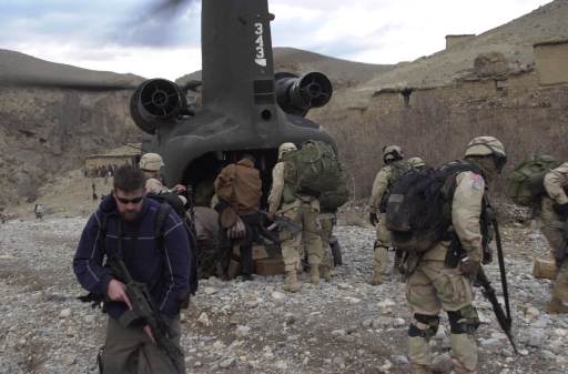 85-24343 unloading humanitarian aid near a village in Afghanistan.