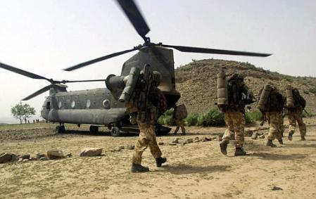 British Royal Marines of 45 Commando board Chinook helicopters.