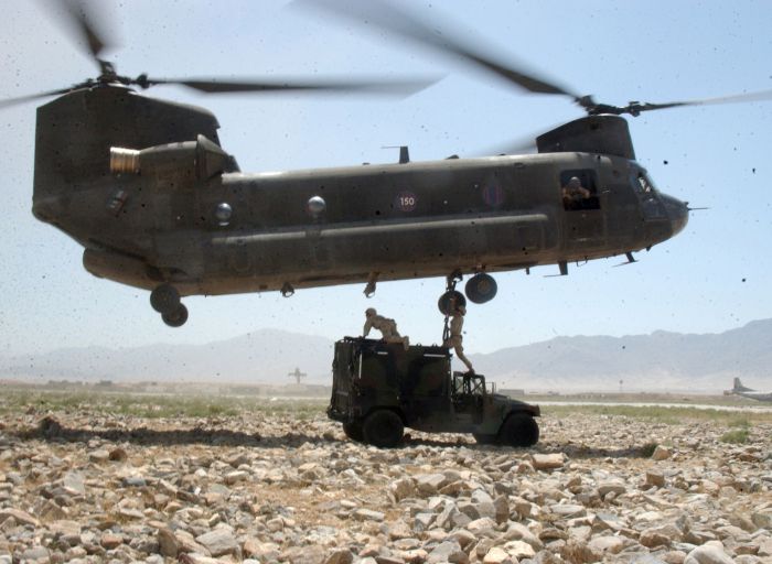 Soldiers prepare to sling-load a vehicle via a CH-47 Chinook helicopter during an operation near Bagram, Afghanistan.