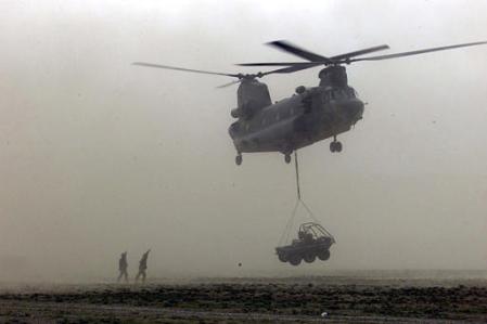 A British Chinook helicopter moves equipment at Camp Taylor.