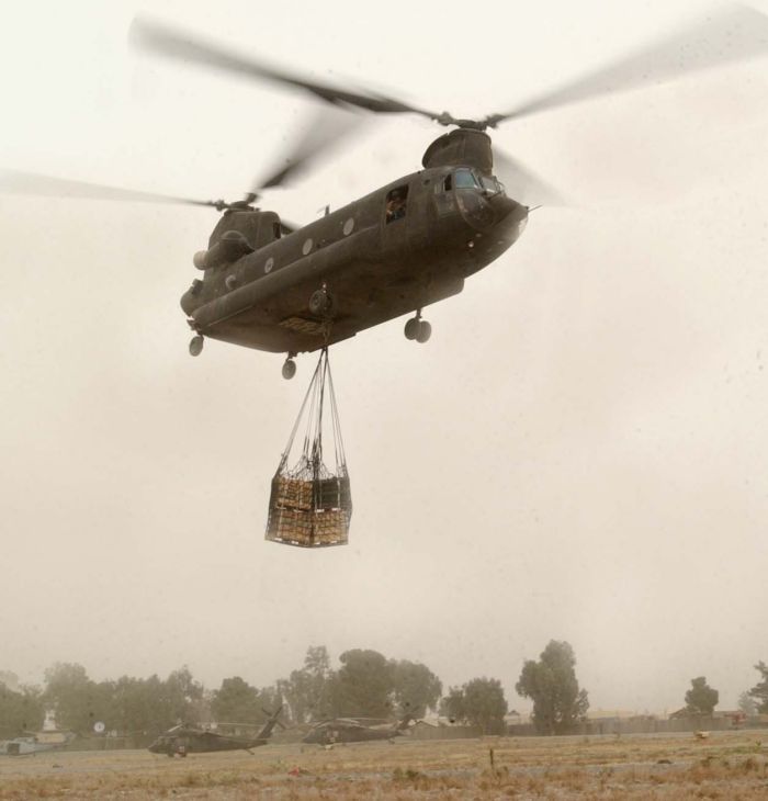 A CH-47D Chinook helicopter lifts off from Forward Operating Base (FOB) Salerno, Afghanistan, on its way to FOB Lwara during an ammunition resupply mission on 9 October 2004.