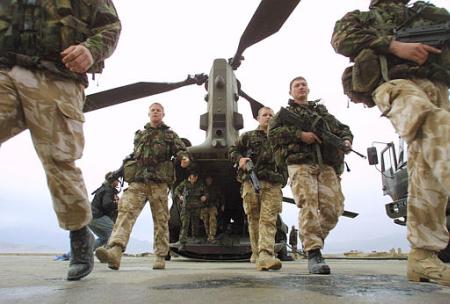 British Marine Commandos walk off an RAF Chinook helicopter