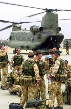 British Royal Marines prepare to board a helicopter at Bagram air base.