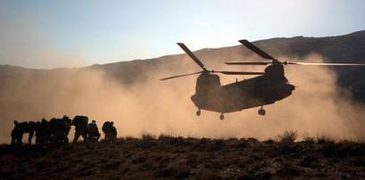 U.S. Army soldiers with the the 82nd Airborne prepare to be extracted by an Army CH-47D Chinook helicopter.