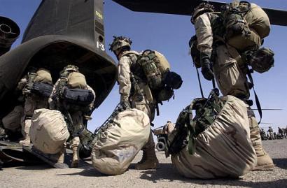 U.S. soldiers board a Chinook for a military operation in Bahgran Valley, southern Helmand province, Afghanistan.