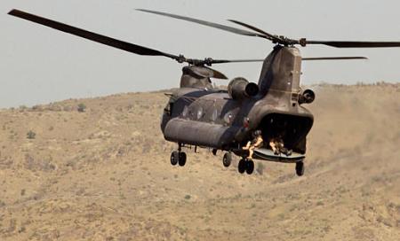 A U.S. Army CH-47D Chinook helicopter carries troops back to their base.