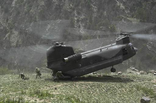 A CH-47D drops off members of a coalition force into the Tora Bora region of Afghanistan in support of Operation Torii on on May 4, 2002.