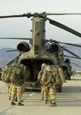 British Royal Marine commandos, part of a force of over 1,000, board Chinook helicopters.