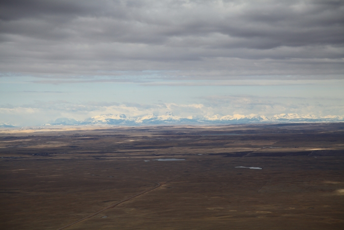 16 April 2012: Having just crossed the border into Canada, the view from Sortie 1 revealed the Northern Rocky Mountains about 30 miles to the west of the route.