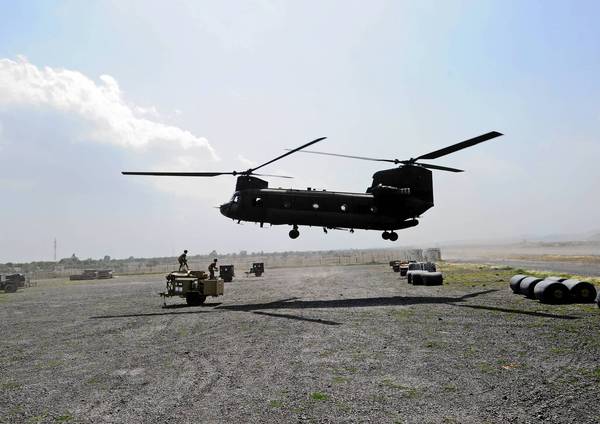 A Chinook helicopter is used by the U.S. Army in Afghanistan. The Pentagon's Inspector General says Boeing charged the Army for new parts while installing used ones on helicopters.