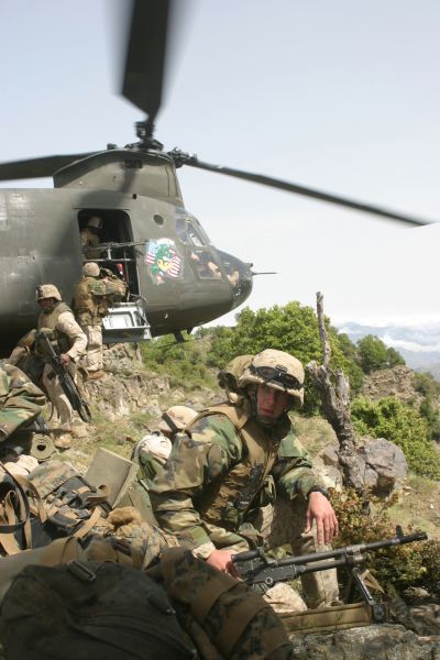 7 May 2005: U.S. Marines provide security as fellow Marines exit a CH-47D Chinook helicopter while conducting security and ambush patrols in the Sarkani Valley of Afghanistan. The Marines of India Company, 3rd Battalion, 3rd Marine Regiment are conducting security and stabilization operations in the valley.
