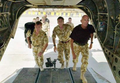 Friday, 25 June 2004: The eight British servicemen held since Monday by Iran for illegal entry into Iranian waters are transported by a Chinook helicopter to Kuwait enroute back to their units. Their earlier release by the Iranian authorities brought an end to a diplomatic stand-off between London and Tehran. The troops were detained Monday after their boats allegedly strayed into the Iranian side of the Shatt al-Arab waterway that runs along the Iran-Iraq border while delivering a patrol boat to Iraq's new river police.