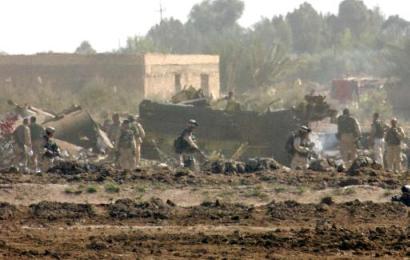 US soldiers inspect the site where a Chinook helicopter was shot down outside the flashpoint town of Fallujah, 50km (30 miles) west of Baghdad.