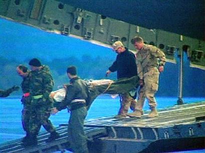 An injured soldier is brought out of a plane on a stretcher at Ramstein Air Base in Germany Monday Nov. 3, 2003 in this image from television. About 18 U.S. soldiers wounded in Sunday's Chinook helicopter attack in Iraq arrived at Ramstein where they will be taken to the nearby Landstuhl Medical Center for treatment.