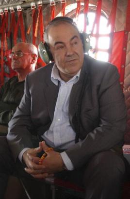 Iraqi Interim Prime Minister Iyad Allawi clicks prayer beads aboard a Chinook helicopter on his first trip outside Baghdad since his appointment. Interim Prime Minister Allawi toured an Iraqi military post in Tikrit and the Muntheria border crossing on the Iran-Iraq border.