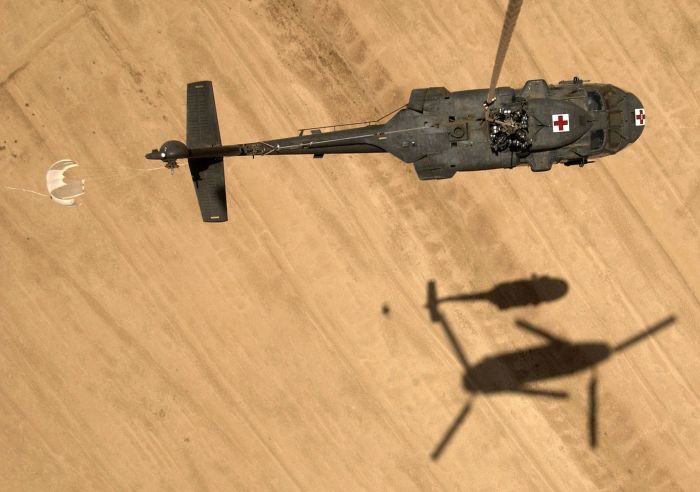 In yet another demonstration of its superior lifting capabilities, a CH-47 Chinook helicopter transports a UH-60 MEDEVAC (Medical Evacuation) Black Hawk helicopter via sling-load to Logistics Support Area Anaconda in Iraq. The Blackhawk helicopter was damaged after a hard landing. Army aviation assets are playing a key role in Operation Iraqi Freedom and the Global War on Terrorism.