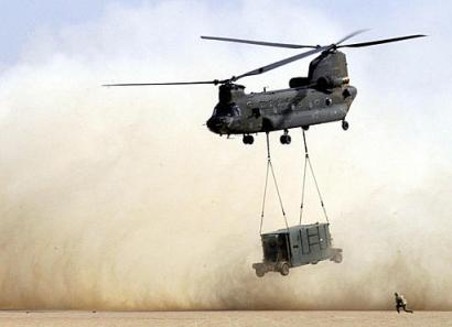 A CH-47D Chinook helicopter with the 101st Airborne Division takes off from Camp New Jersey in Kuwait.