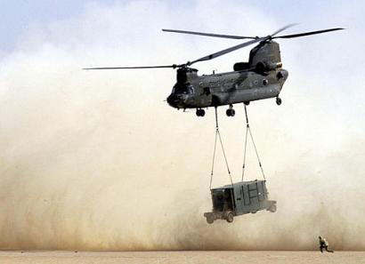 A CH-47D Chinook helicopter with the 101st Airborne Division takes off from Camp New Jersey in Kuwait.