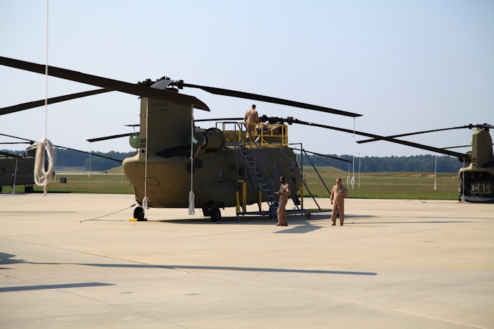 Aircrews from the CH-47F Chinook helicopter New Equipment Training Team (NETT) preflight 12 airframes that will be flown to the docks at the Port of Baltimore over the next three days.