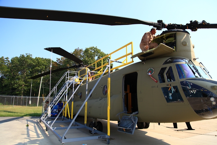 11 September 2013: Rich Feltzer, NET Team Maintenance Test Pilot, preflights CH-47F Chinook helicopter 12-08106.