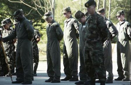 Members of the E Company, 160th Special Operations Aviation Regiment pay thier respects to fallen comrades.