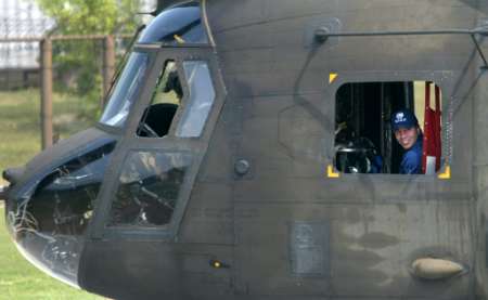 USA soccer team coach Bruce Arena peers out from the window of a U.S. Army Chinook helicopter.