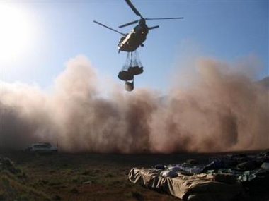 16 November 2005: A British Royal Air Force Chinook helicopter lifts aid supplies for earthquake victims at an air strip near Muzaffarabad.