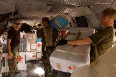 29 October 2005: In Islamabad, British troops load a Chinook helicopter with medical aid to be flown out to the more remote and effected areas within Pakistan. 27 Squadron Royal Air Force from RAF Odiham have provided three Chinook helicopters in which relief aid will be transported.