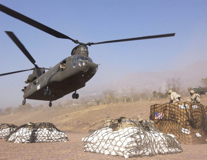 20 December 2005: Soldiers prepare to externally load humanitarian relief supplies onto a CH-47D Chinook helicopter at Muzaffarabad, Pakistan, for delivery to remote villages affected by the Oct. 8 earthquake.