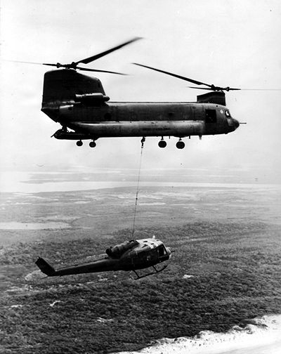 Downed aircraft recovery in the Republic of Vietnam. Note the Ramp Gunner.