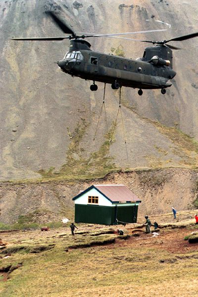 A CH-47D, belonging to 1st Battalion, 106th Aviation Regiment, part of the Army National Guard located in the State of Illinois, deployed to Iceland and helped move this house onto its new foundation.