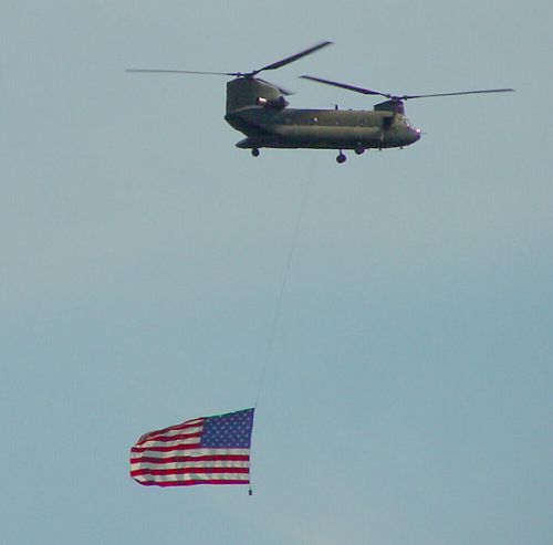 A Pennsylvania Army National Guard Chinook slings the Stars and Stripes after 9-11.