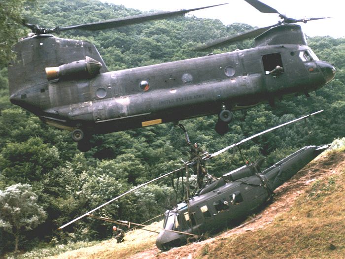 A CH-47C Chinook recovers a downed UH-1 Huey in Korea, date unknown.