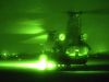 A Hercules Chinook helicopter in the light of night vision goggles. Click-N-Go to view a larger version of this image.