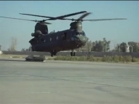 View the Video: An unknown CH-47D Chinook helicopter lands with a broken aft landing gear at an unknown location.